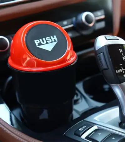 Compact car dustbin in a car dash